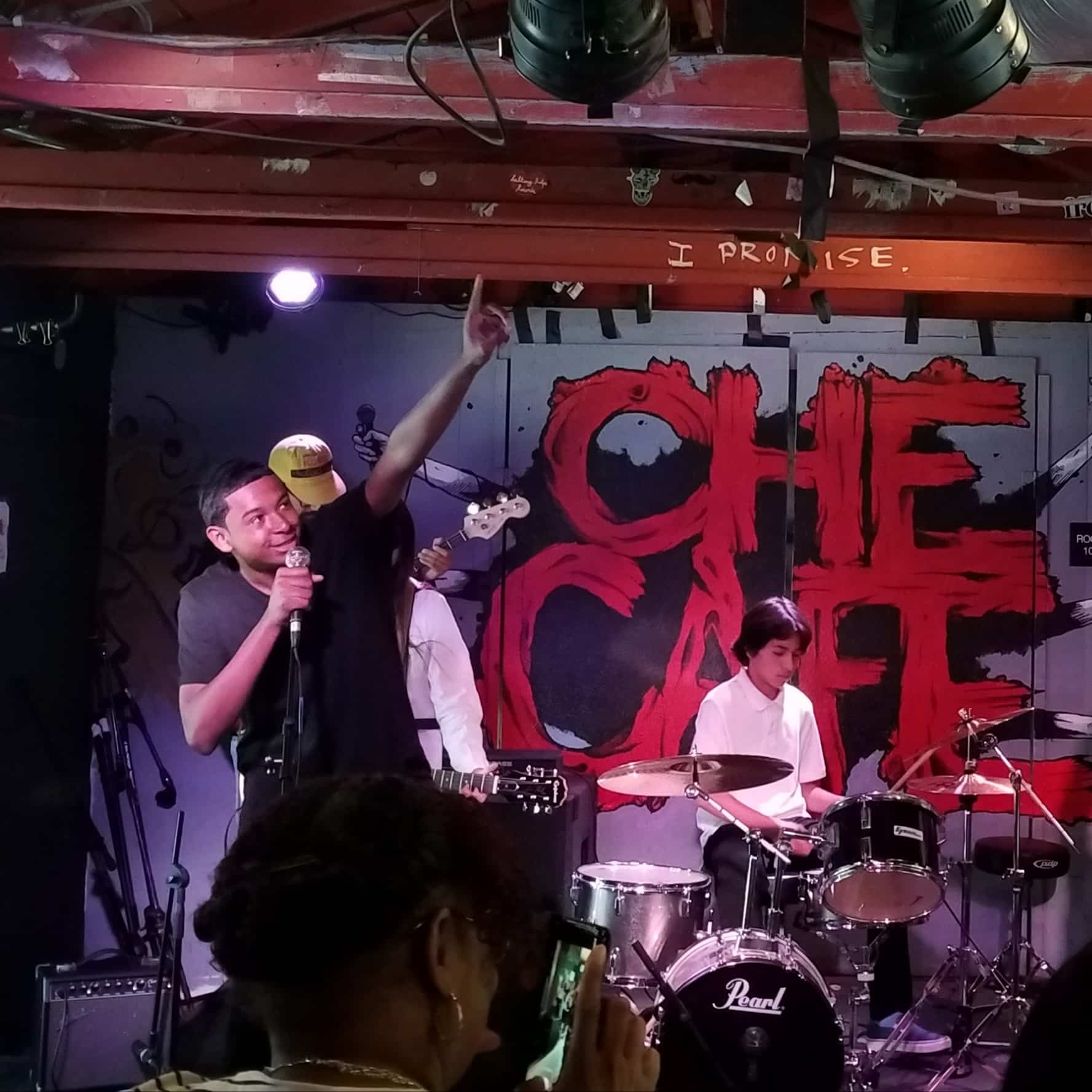 Students in a rock band at Che Cafe